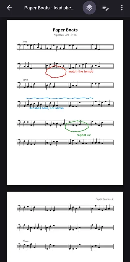 Partitura en PDF anotada a mà dins de l’app, amb cercles i notes escrites en vermell, blau i verd